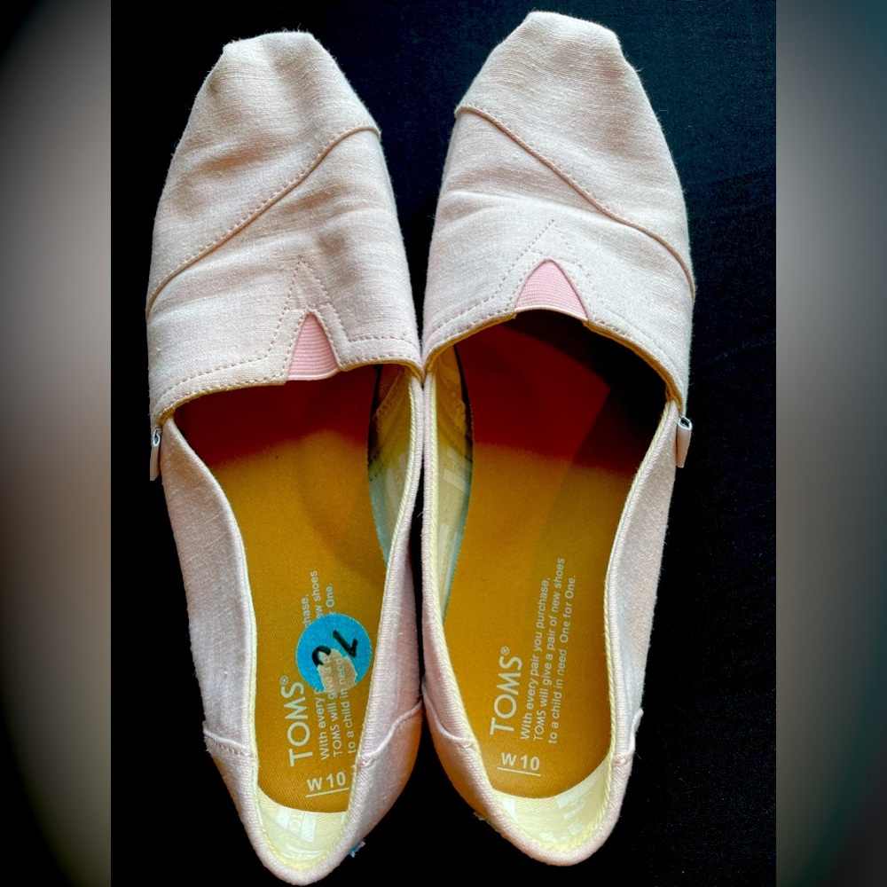 Tom’s pink slip ons